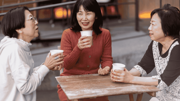 Women at age of menopause having tea