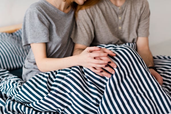 A pair of couple holding hands 